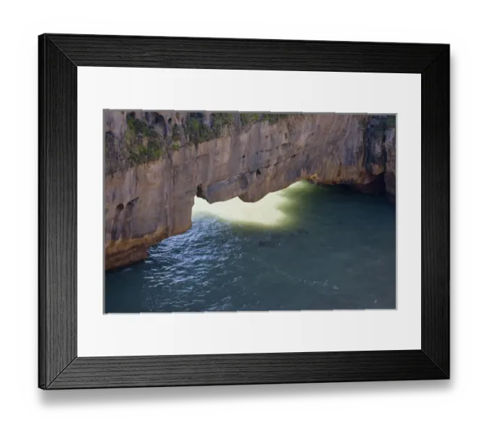 Framed Print : South Pacific, New Zealand, South Island. Sunlight on ocean under limestone sea arch