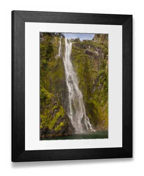 Framed Print : New Zealand, South Island, Fiordland National Park. Waterfall cascades into Milford Sound Framed Print : New Zealand, South Island, Fiordland National Park. Waterfall cascades into Milford Sound