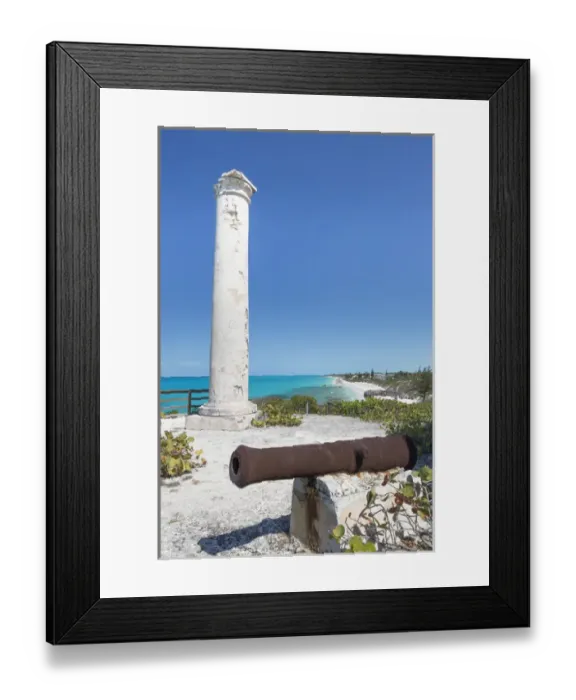 Framed Print : Bahamas, Little Exuma Island. Rusty cannon and column marking salt ponds location