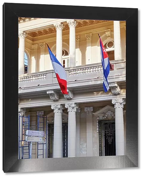 West Indies, Cuba, Havana. French and Cuban flags fly from building