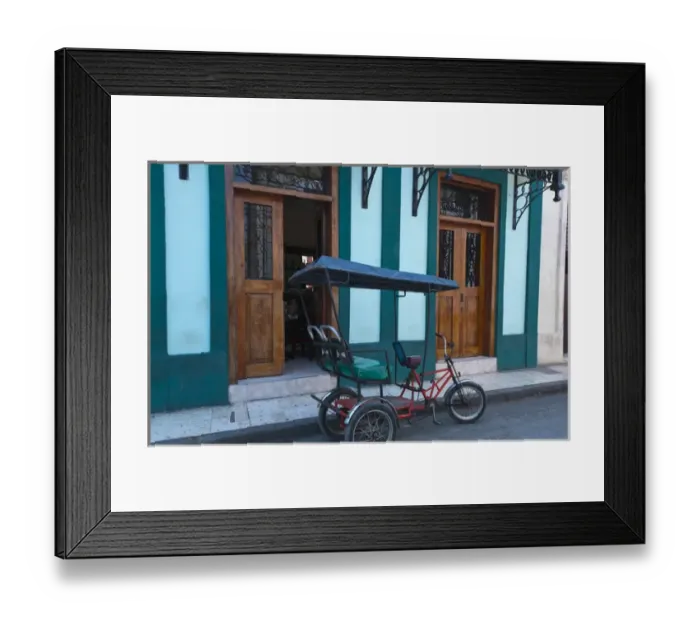 Framed Print : Camaquey Cuba street scene of old bike carriage on street and buildings Framed Print : Camaquey Cuba street scene of old bike carriage on street and buildings