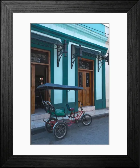 Framed Print : Camaquey Cuba street scene of old bike carriage on street and buildings Framed Print : Camaquey Cuba street scene of old bike carriage on street and buildings