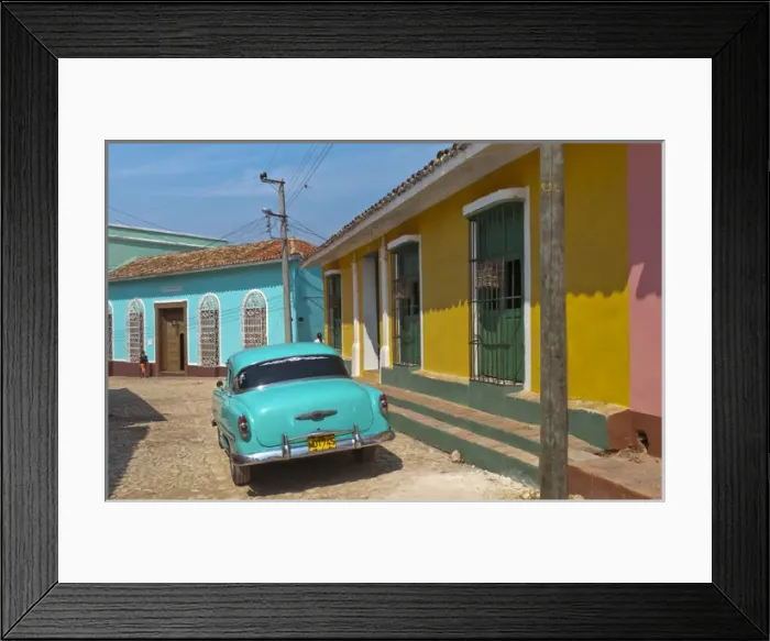 Framed Print : Trinidad Cuba with blue classic 1950s Chevrolet auto on cobbled streets in colorful