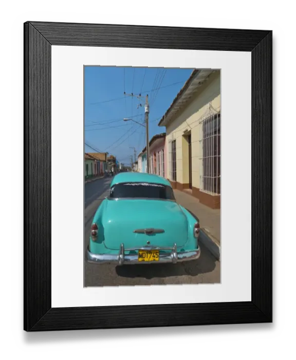 Framed Print : Trinidad Cuba with blue classic 1950s Chevrolet auto on cobbled streets in colorful
