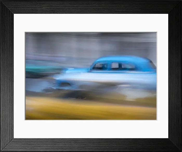 Framed Print : Cuba, Havana. Classic cars speed by in a blur along the streets of the city Framed Print : Cuba, Havana. Classic cars speed by in a blur along the streets of the city
