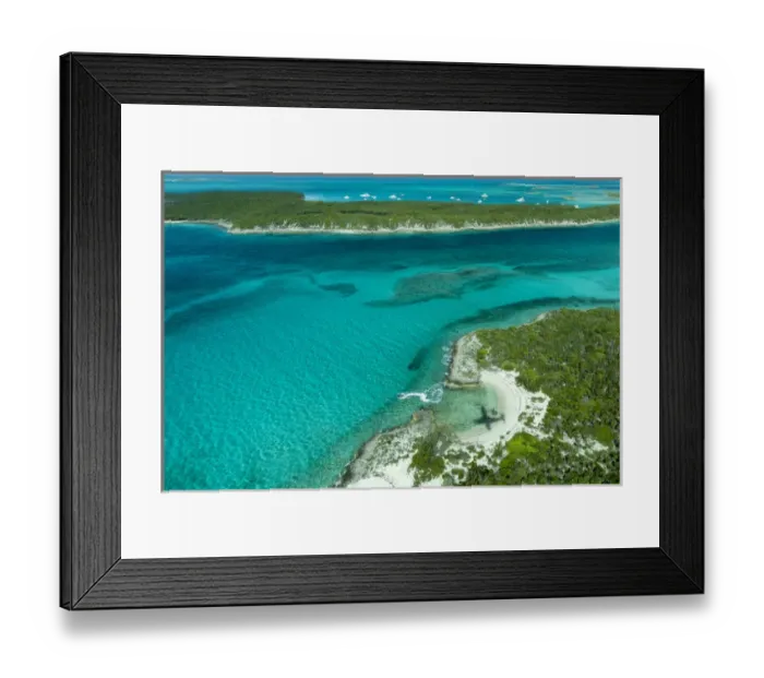 Framed Print : Aerial photo looking down at the airplanes shadow a jetski and clear tropical water Framed Print : Aerial photo looking down at the airplanes shadow a jetski and clear tropical water