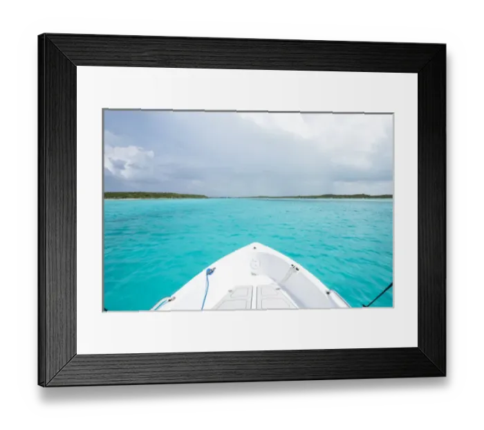 Framed Print : A boat drives through clear aquamarine waters near Staniel Cay, Exuma, Bahamas Framed Print : A boat drives through clear aquamarine waters near Staniel Cay, Exuma, Bahamas