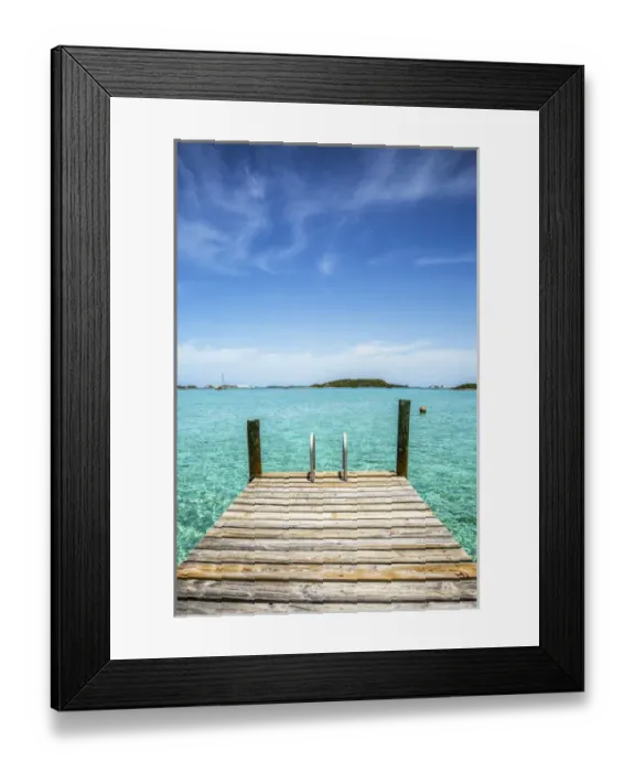 Framed Print : Vertical photo with a dock in the foreground, clear water and blue sky in the background Framed Print : Vertical photo with a dock in the foreground, clear water and blue sky in the background