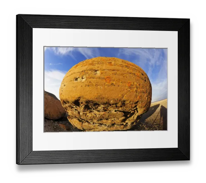 Framed Print : Canada, Alberta, Red Rock Coulee Natural Preserve. Round sandstone concretion. Credit as Framed Print : Canada, Alberta, Red Rock Coulee Natural Preserve. Round sandstone concretion. Credit as
