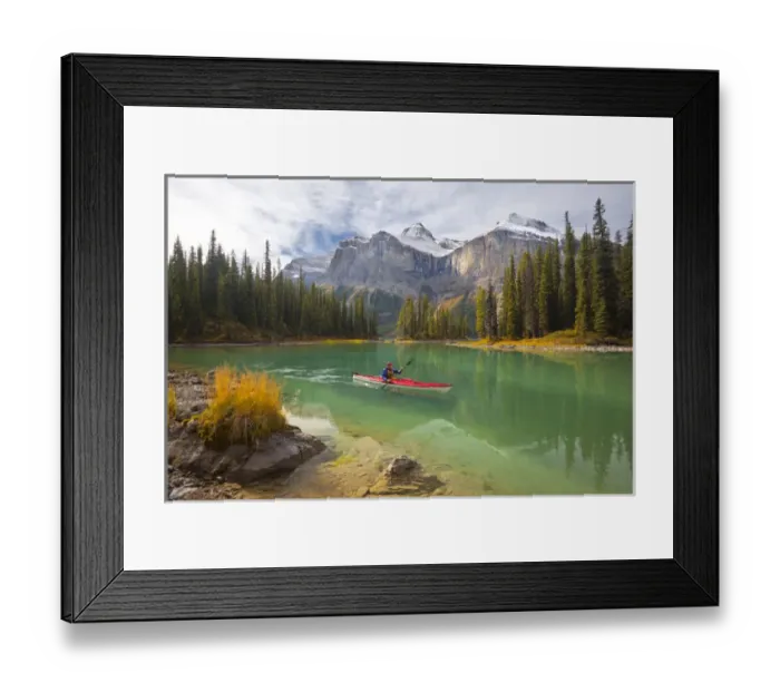 Framed Print : Canada, Alberta, Jasper National Park. A male sea kayaker paddles on Maligne Lake Framed Print : Canada, Alberta, Jasper National Park. A male sea kayaker paddles on Maligne Lake