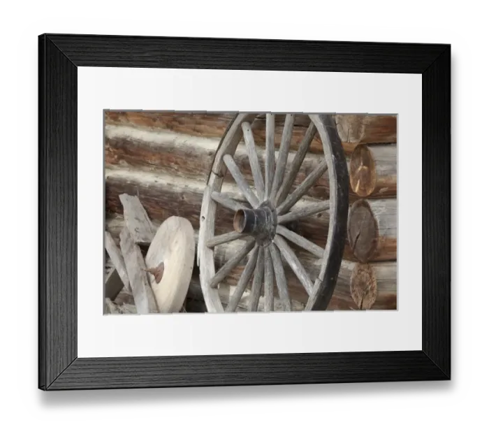 Framed Print : Canada, British Columbia, Fort Steele. Close-up of old wagon wheel, grinding stone, and log cabin Framed Print : Canada, British Columbia, Fort Steele. Close-up of old wagon wheel, grinding stone, and log cabin