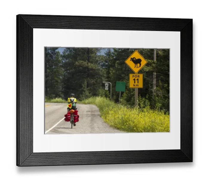 Framed Print : Bicycle touring on the Adventure Cycling Glacier Waterton tour near Fernie, British Columbia