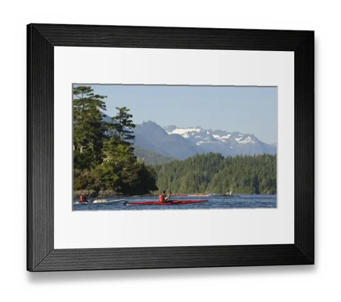 Framed Print : Vancouver Island, Tofino. Sea kayakers with snow covered mountains of Strathcona Framed Print : Vancouver Island, Tofino. Sea kayakers with snow covered mountains of Strathcona