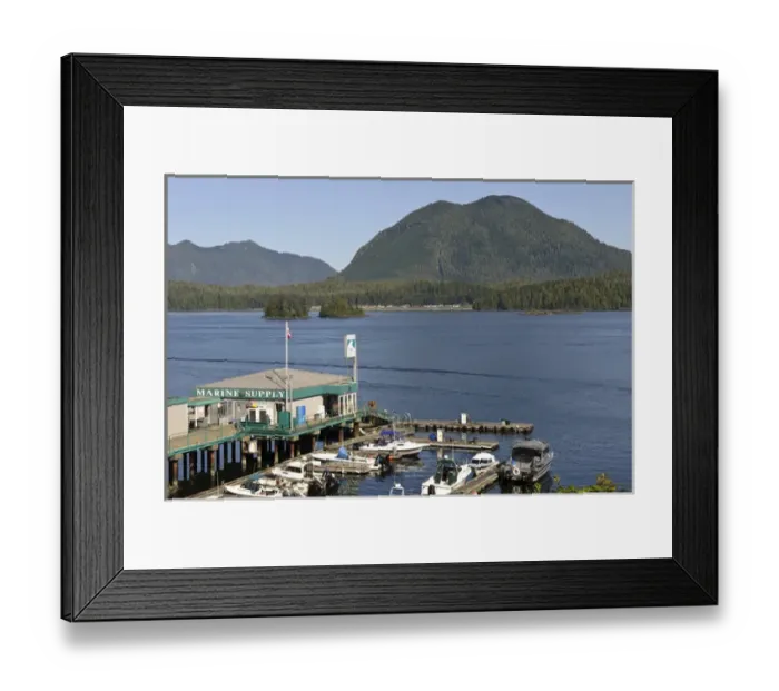 Framed Print : Vancouver Island, Tofino. Dock and marine supply store, Meares Island in background