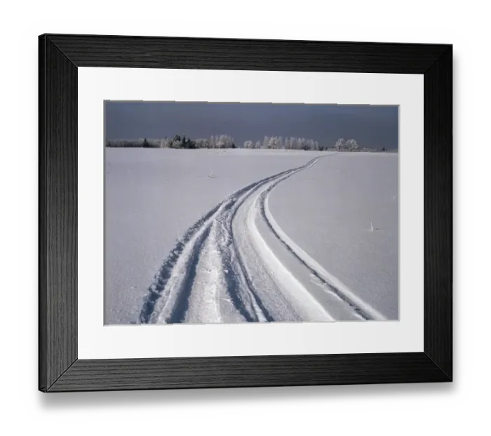 Framed Print : Canada, Manitoba, Tire tracks in snow landscape