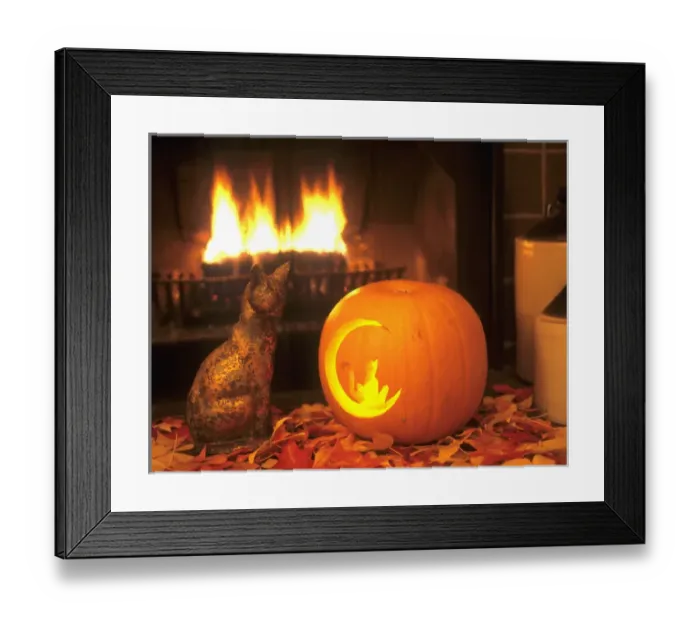 Framed Print : Halloween themed image of ceramic cat facing carved pumpkin with a cat on the moon Framed Print : Halloween themed image of ceramic cat facing carved pumpkin with a cat on the moon