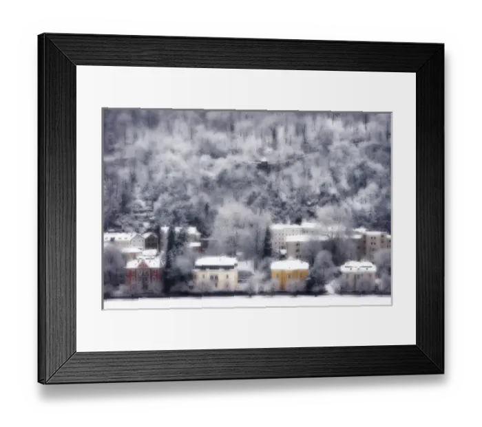Framed Print : Europe, Austria, Salzburg. Dreamlike view of residences and snow-covered trees on hillside
