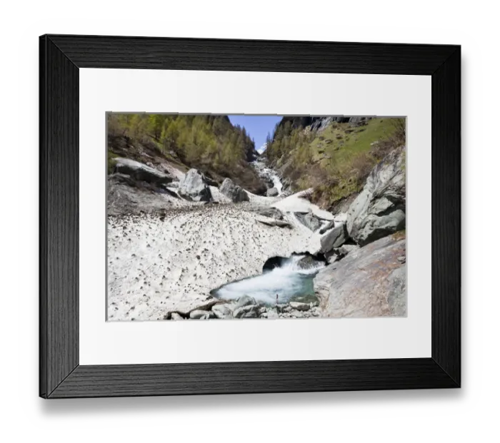Framed Print : The cascades of the river Isel in national Park Hohe Tauern. Rests of avelanche are covering Framed Print : The cascades of the river Isel in national Park Hohe Tauern. Rests of avelanche are covering