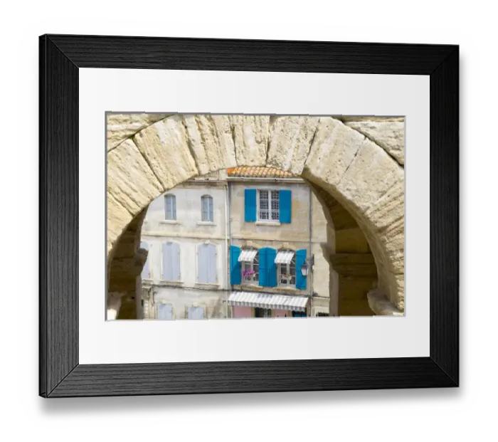 Framed Print : France, Arles, Roman Amphitheater arch and typical French window scene
