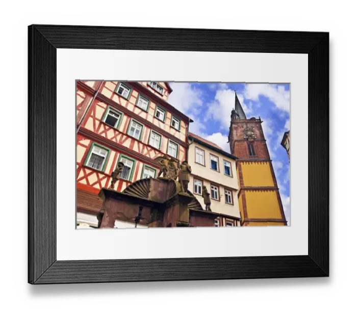Framed Print : Wertheim, Franconia, Germany, a medieval water well in front of Cross Timbered Houses Framed Print : Wertheim, Franconia, Germany, a medieval water well in front of Cross Timbered Houses