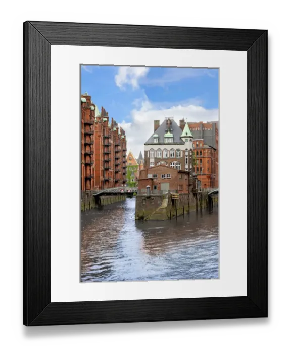 Framed Print : Waterfront warehouses and lofts in the Speicherstadt warehouse district of Hamburg Framed Print : Waterfront warehouses and lofts in the Speicherstadt warehouse district of Hamburg