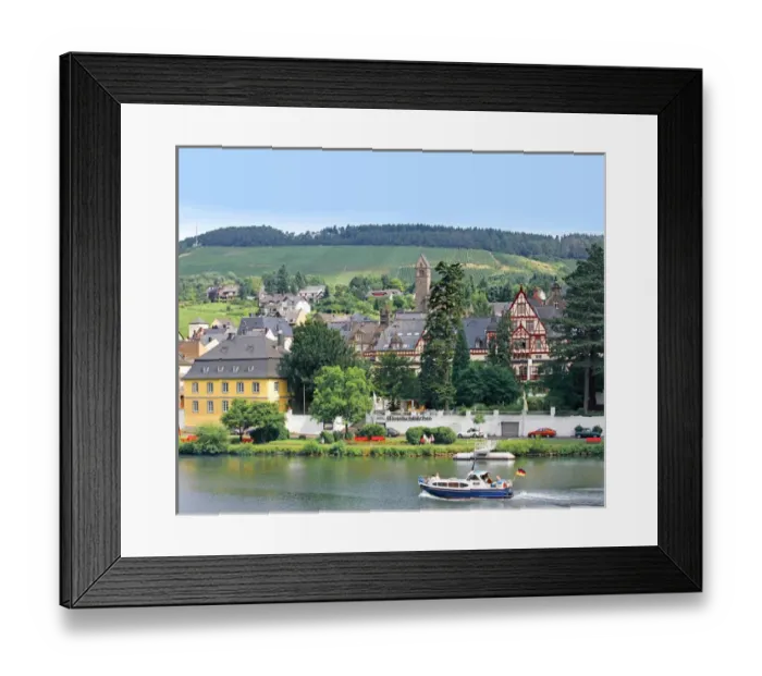 Framed Print : A yacht sails by the town of Traben-Trarbach, Germany along the Mosel River Framed Print : A yacht sails by the town of Traben-Trarbach, Germany along the Mosel River