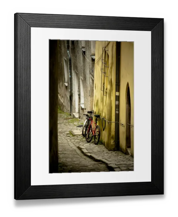Framed Print : 2 bicycles on cobblestone street, Passau, Germany