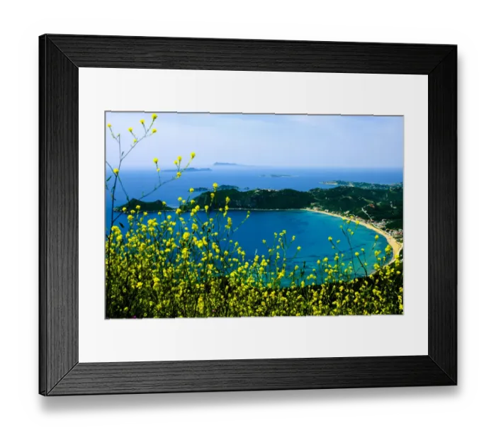 Framed Print : Corfu, Greece. Aerial view of a circular beach and land on Corfu with yellow wild flowers Framed Print : Corfu, Greece. Aerial view of a circular beach and land on Corfu with yellow wild flowers