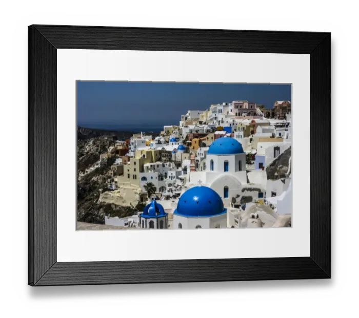 Framed Print : Oia, Santorini, Greece. Blue dome Greek Orthodox churches, white washed and colored Framed Print : Oia, Santorini, Greece. Blue dome Greek Orthodox churches, white washed and colored