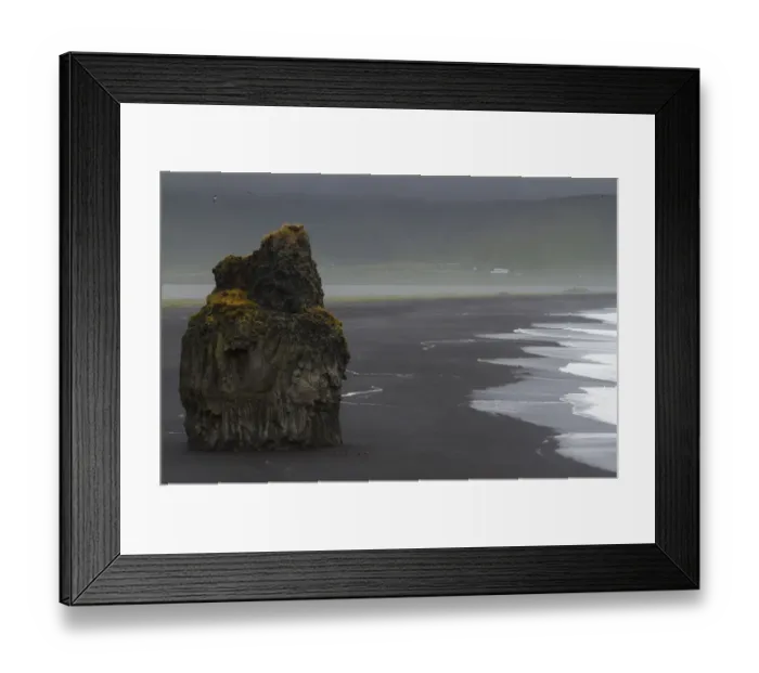 Framed Print : Europe, Iceland, Vik. Basalt column rises from black sand beach on rainy day. Credit as