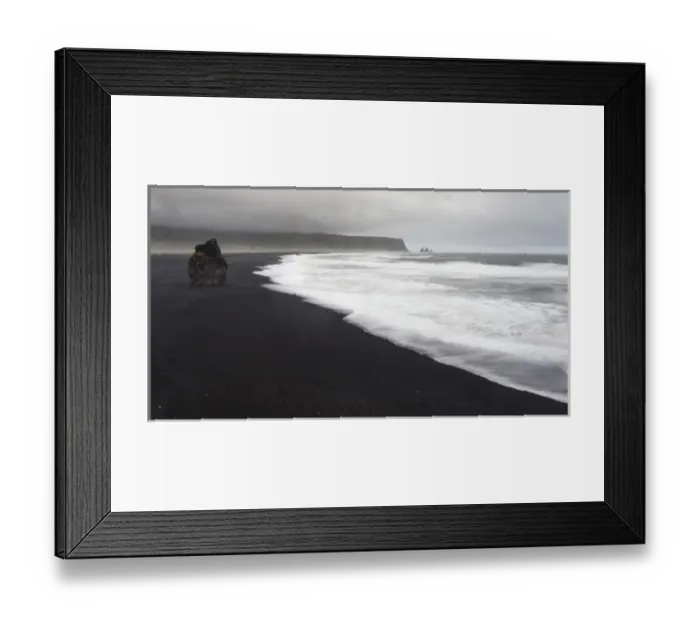 Framed Print : Europe, Iceland, Vik. Basalt column rises from black sand beach on rainy day. Credit as
