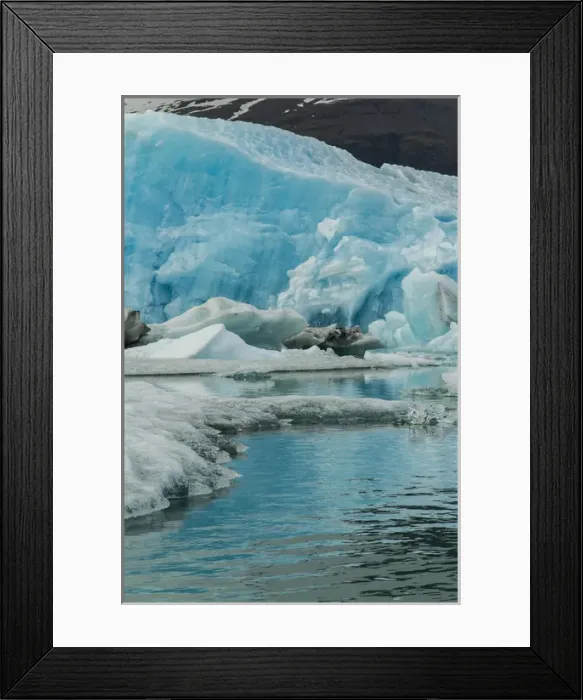 Framed Print : Europe, Iceland, Jokusarlon. Blue iceberg reflects in water