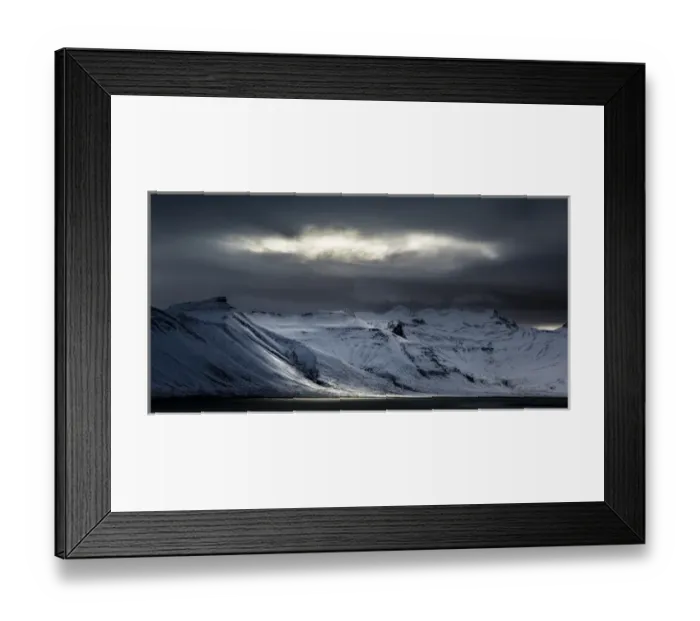 Framed Print : Iceland. Sunlight bursts through storm clouds
