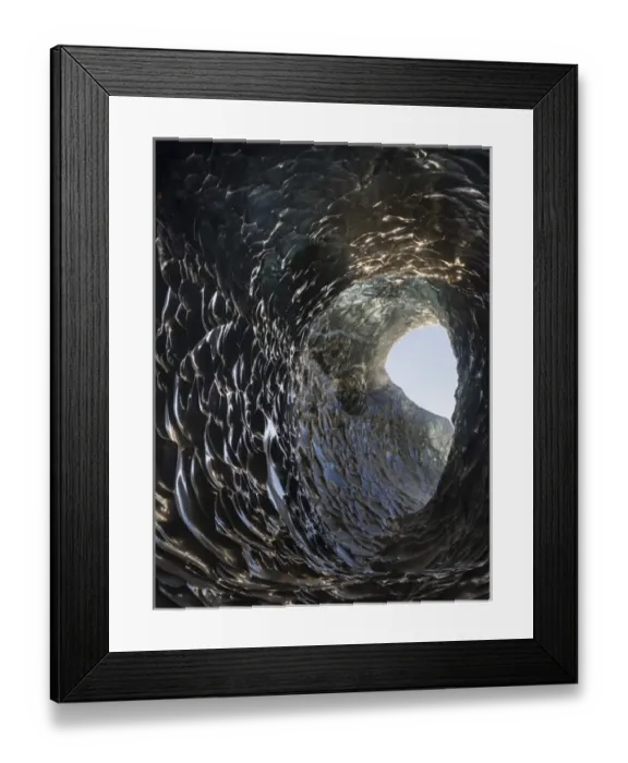 Framed Print : Ice cave in the glacier Breidamerkurjoekull in Vatnajoekull National Park. Entrance to the Ice Cave
