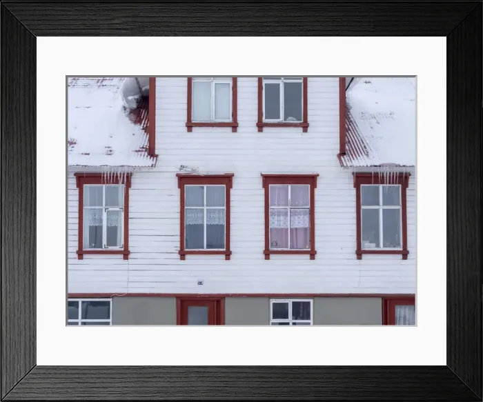 Framed Print : Akureyri during winter. Old town with traditional and historic buildings