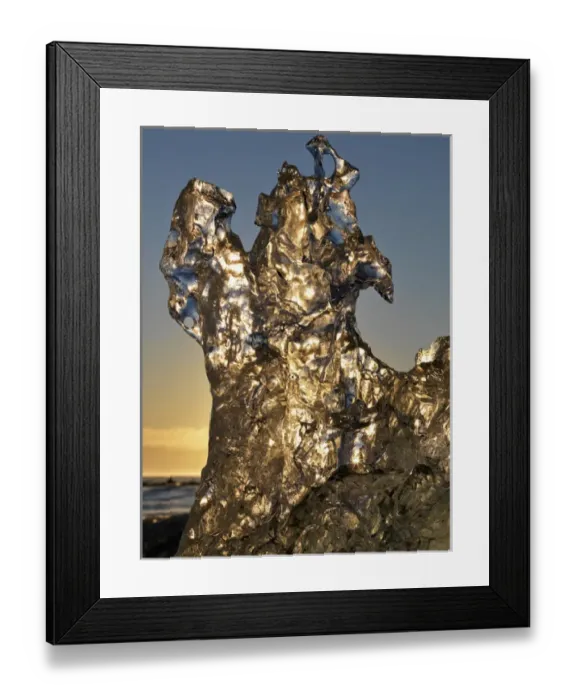 Framed Print : Golden sunrise seen through iceberg formation on the beach at Jokulsarlon, Iceland Framed Print : Golden sunrise seen through iceberg formation on the beach at Jokulsarlon, Iceland
