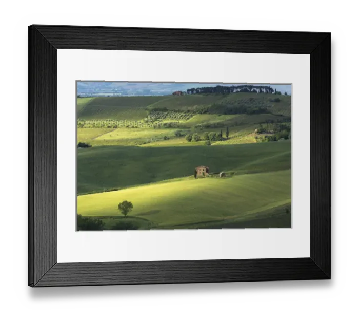 Framed Print : Europe, Italy, Tuscany. Dappled light spreads across rolling green hills of farmland