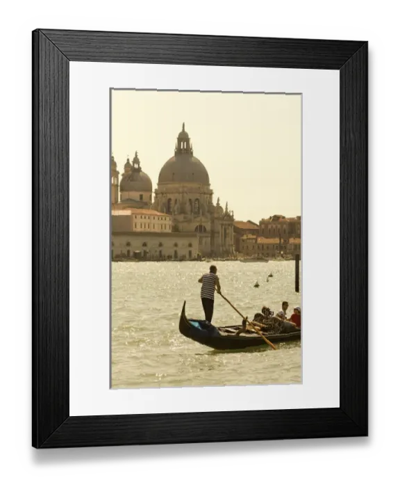 Framed Print : Italy; Venice. A gondolier ferries tourists on the Grand Canal in Venice with the massive church Framed Print : Italy; Venice. A gondolier ferries tourists on the Grand Canal in Venice with the massive church