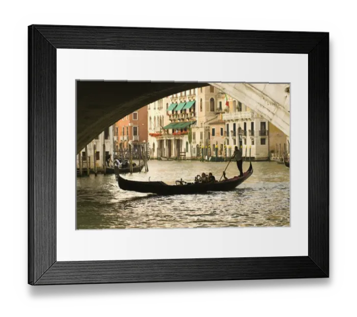 Framed Print : Italy; Venice. Tourist take snap shots from a gondola as they pass under the Rialto Framed Print : Italy; Venice. Tourist take snap shots from a gondola as they pass under the Rialto