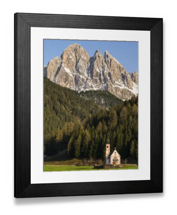 Framed Print : The peaks of the Geisler mountain range in valley Villnoess. The church Sankt Johann in Ranui (St Framed Print : The peaks of the Geisler mountain range in valley Villnoess. The church Sankt Johann in Ranui (St