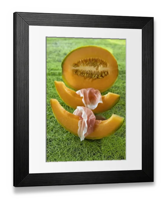 Framed Print : Melon wedges (Cucumis melo) and ham, italian gastronomy