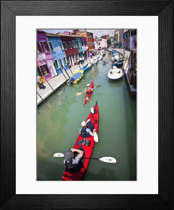 Framed Print : Europe; Italy; Burano; Bright Colored Homes Along the Canal with Kyakers Traveling