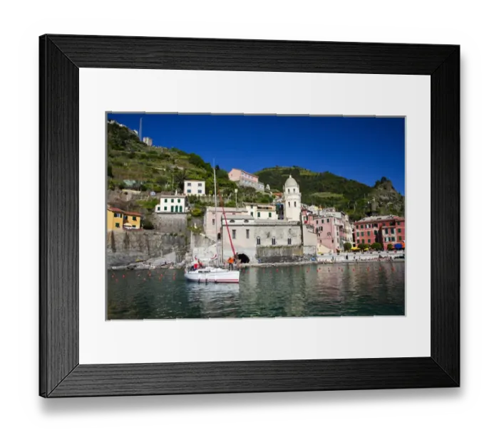 Framed Print : Europe; Italy; Vernazza; Sail Boat landing at the City and Church of Santa Margherita