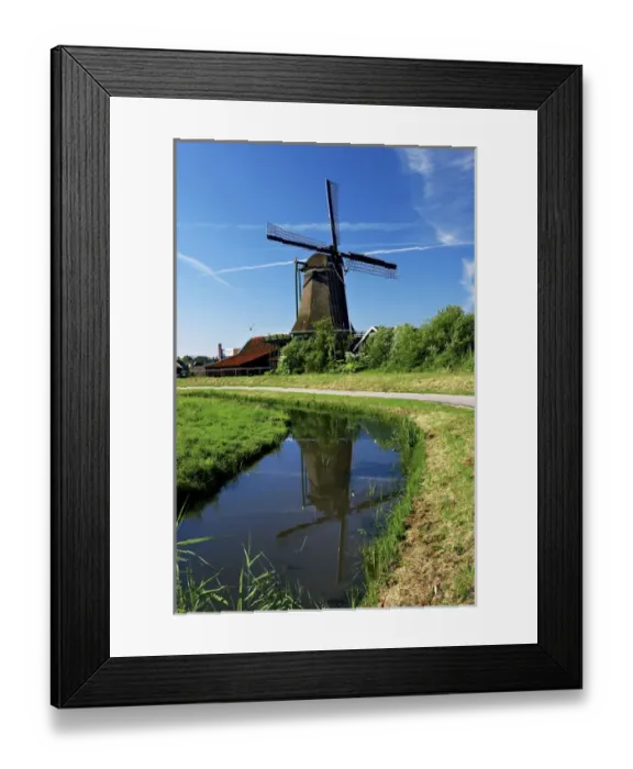 Framed Print : Netherlands, North Holland, Zaanstad, Zaanse Schans, Windmills, Pathway along the canal Framed Print : Netherlands, North Holland, Zaanstad, Zaanse Schans, Windmills, Pathway along the canal