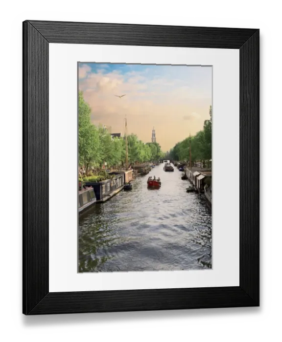 Framed Print : Netherlands, Amsterdam, Boats cruise along a canal with the Zuiderkerk bell-tower in the background Framed Print : Netherlands, Amsterdam, Boats cruise along a canal with the Zuiderkerk bell-tower in the background