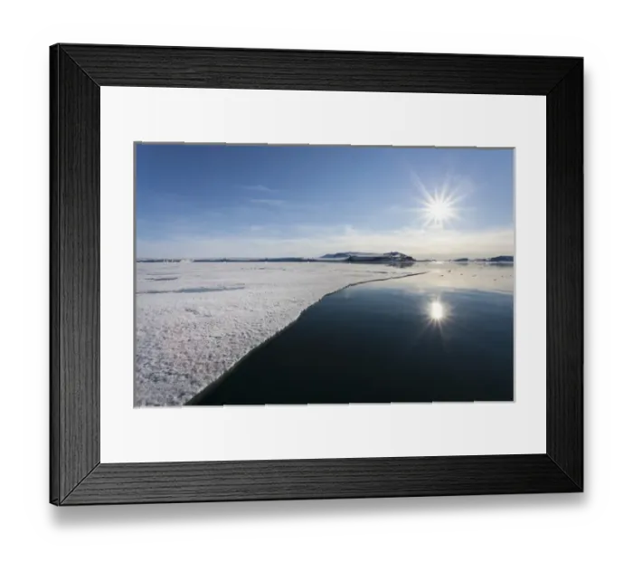Framed Print : Europe, Svalbard. Sunburst reflected in still water at edge of shorefast ice. Credit as Framed Print : Europe, Svalbard. Sunburst reflected in still water at edge of shorefast ice. Credit as