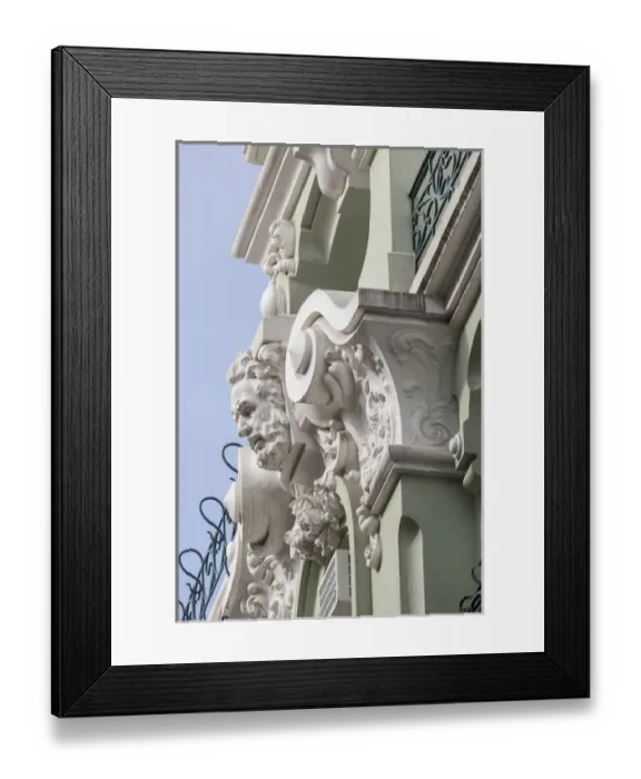 Framed Print : Portugal, Lisbon. Pombaline district, stone faces and animal heads adorn pastel colored Framed Print : Portugal, Lisbon. Pombaline district, stone faces and animal heads adorn pastel colored