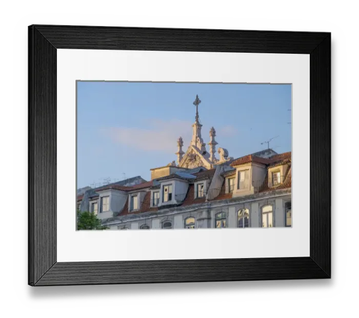 Framed Print : Portugal, Lisbon. Church spire looms out from behind apartment buildings at sunset Framed Print : Portugal, Lisbon. Church spire looms out from behind apartment buildings at sunset