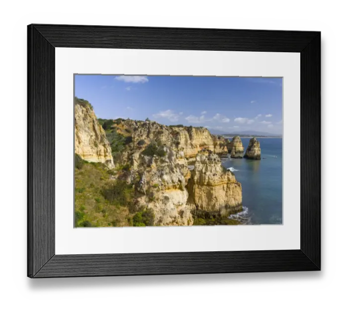 Framed Print : The cliffs and sea stacks of Ponta da Piedade at the rocky coast of the Algarve in Portugal