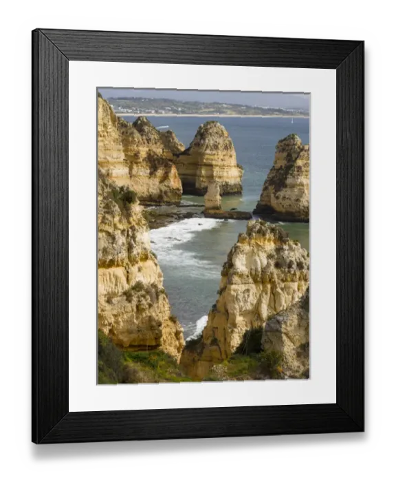 Framed Print : The cliffs and sea stacks of Ponta da Piedade at the rocky coast of the Algarve in Portugal
